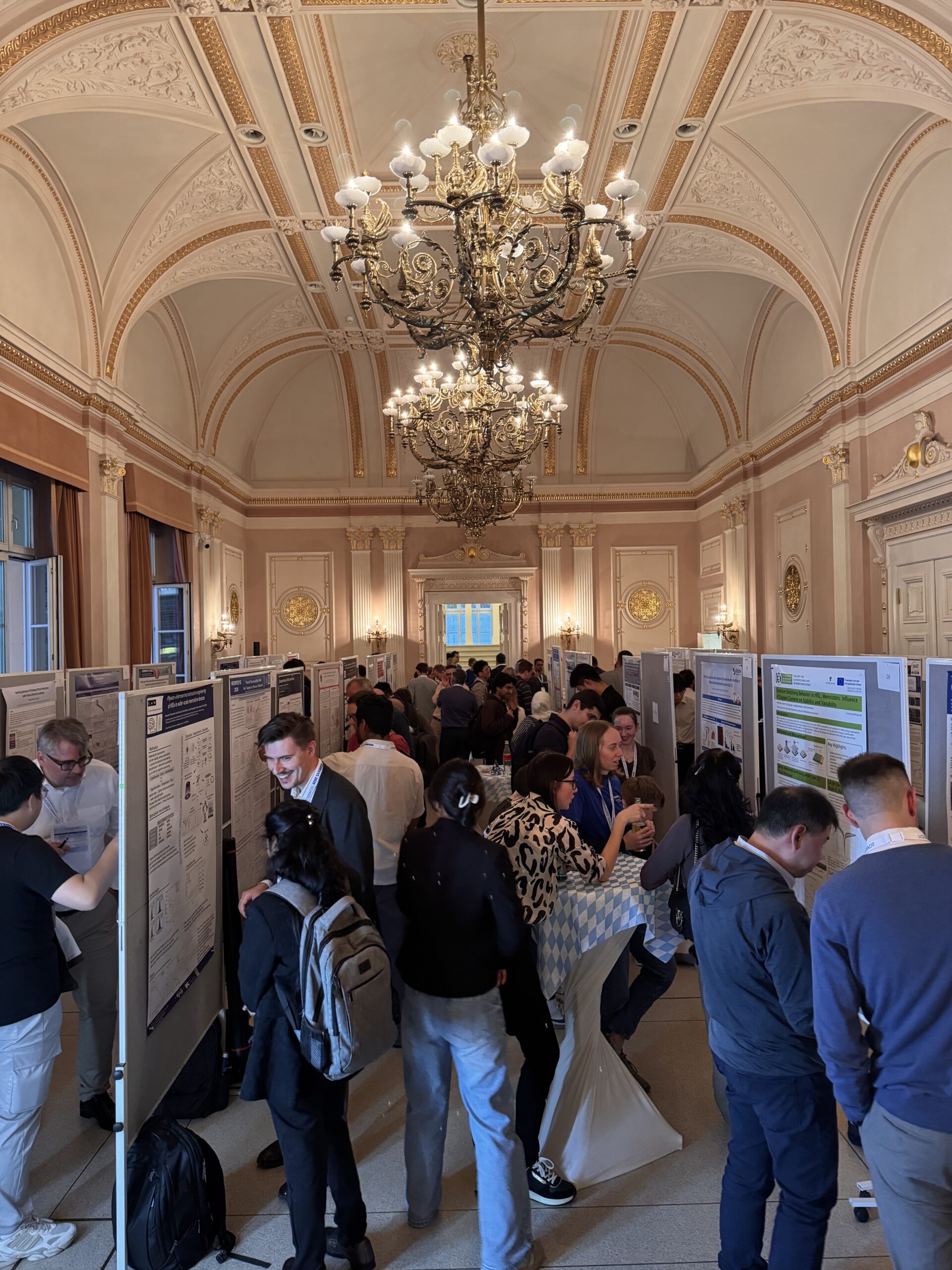 nVolts at MEMRISYS 2026: Connecting Research with Practical Hardware 8 Researchers exchanging ideas at the MEMRISYS poster session